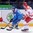 MINSK, BELARUS - MAY 13: Italy's Nathan di Casmirro #13 carries the puck along with boards with pressure from Denmark's Patrick Bjorkstrand #11 during preliminary round action at the 2014 IIHF Ice Hockey World Championship. (Photo by Richard Wolowicz/HHOF-IIHF Images)


